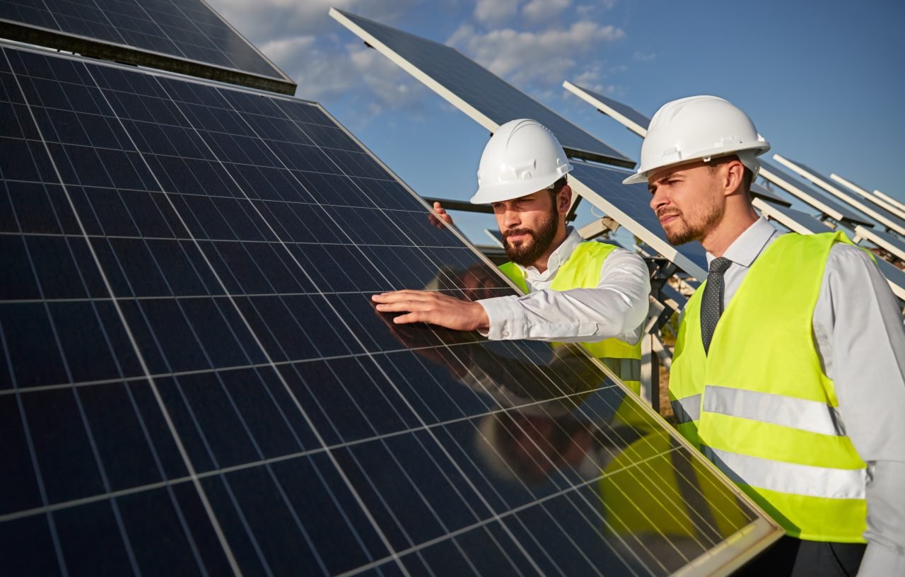 technicians-examining-solar-panels-installation.jpg